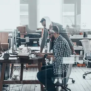Successful team. Group of young business people working and communicating together in creative office